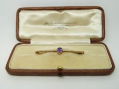 A 9ct gold brooch set with an amethyst,