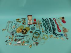 A collection of costume jewellery including compacts, beads, bangles, agate pendants, antique boxes,