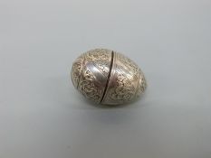 An 18thC white metal three part pomander, vinaigrette or spice holder of ovoid form,