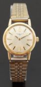 Longines gold plated ladies wristwatch with two tone hands and baton markers, on metal bracelet,