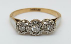 An 18ct gold ring set with three diamonds in a platinum star setting, 2.