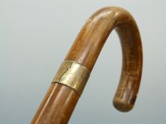 A gentleman's umbrella with cane handle by Brigg and hallmarked 14ct gold collar,