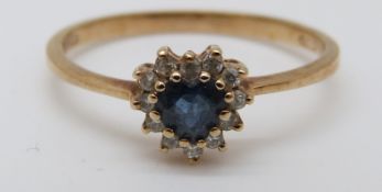 A 9ct gold ring set with a heart shaped sapphire,