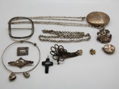 A Victorian silver locket with chased foliate decoration, Victorian silver sweetheart brooch,