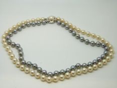 A two strand cultured pearl necklace, one strand grey,