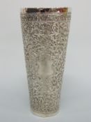 A probably Kutch Indian white metal beaker with embossed decoration and vacant cartouche, 17.