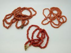 Three coral necklaces.