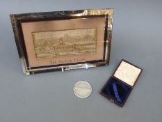 An 1884 cased silver plated medallion by Pinches issued to commemorate the opening of The Crystal