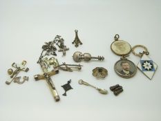 A Victorian silver locket set with a portrait of a gentleman,