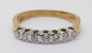 An 18ct gold half eternity ring set with diamonds, 2.