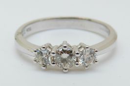 An 18ct white gold ring set with three diamonds totalling approximately 0.