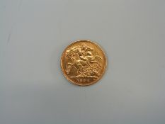 A 1908 Edward VII gold half sovereign.