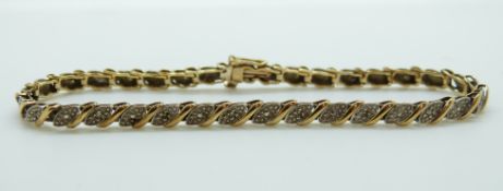 A 9ct gold bracelet set with diamonds, 7.