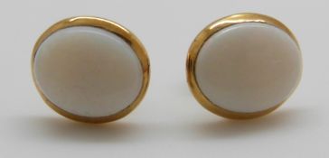 A pair of 14ct gold earrings set with an opal to each