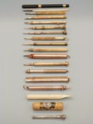 A collection of antique pens including 9ct gold, inlaid bone,