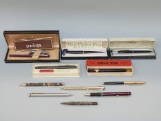 A collection of pens including boxed Swan self filler, boxed Sheaffer, boxed White Dot,