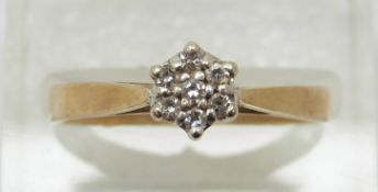 A 9ct gold ring set with diamonds in a cluster, 2.
