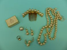 A collection of Edwardian faux pearls including necklace, ring,