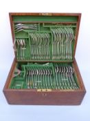 A Victorian and later oak cased 12 place setting canteen of Kings pattern hallmarked silver cutlery