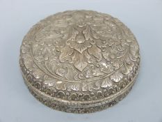 A white metal embossed box diameter 11.