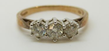 A 9ct gold ring set with three diamonds, total diamond weight approximately 0.