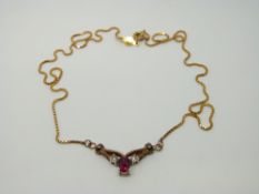 A 9ct gold necklace set with diamonds and synthetic ruby, 5.