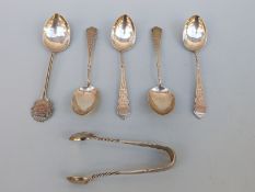 Four hallmarked silver teaspoons and matching tongs, Birmingham 1906 and a collectors' silver spoon,