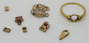 A yellow metal ring and sections of chains (1.