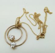 A 9ct gold necklace set with two cubic zirconia, 0.