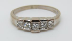 An 18ct white gold ring set with princess cut diamonds, the largest stone approximately 0.18ct, 4.