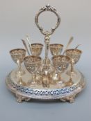 A Victorian Mappin Brothers hallmarked silver six person egg cruet with pierced and engraved
