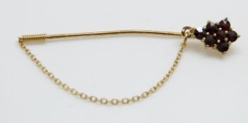 A 9ct gold stick pin set with garnets- NOT GOLD RING THEN DELETE