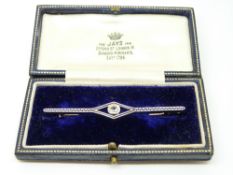 A 15ct gold brooch set with an old cut diamond measuring approximately 0.