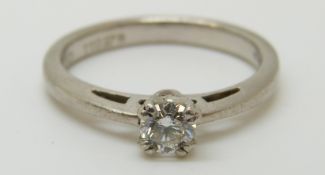 A platinum ring set with a diamond of approximately 0.28ct, 4.