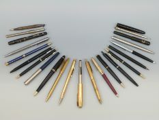A collection of vintage pens including Burnham, Parker, Eversharp,