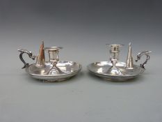 A pair of 19thC plated chambersticks with snuffers,