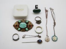 A silver necklace set with a mother-of-pearl flower and blue enamel, silver rings,