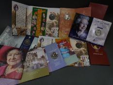 A collection of commemorative £5 crowns in original packs, includes Victoria and Queen Mother,