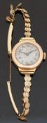 9ct gold ladies wristwatch with Arabic numerals, blued Breguet hands and silvered face,