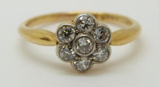An 18ct white gold ring set with diamonds in a cluster (size L)