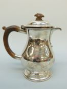 A George V Mappin & Webb hallmarked silver hot water jug, London 1933, height 19