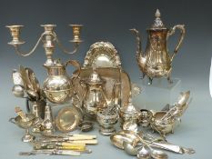 A collection of plated ware including a Guernsey cream jug, height 16cm, tea set, dishes,