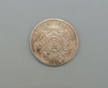 An 1869 Napoleon III five Franc coin with Paris mint mark and Strasburg engraver's mark