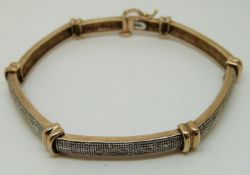 A 9ct gold bracelet set with diamonds (12.