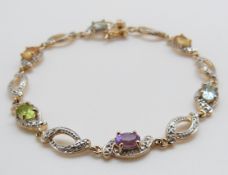 A 9ct gold bracelet set with diamonds and various gemstones, 9.