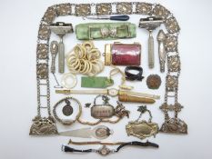 An enamel book cover, silver plated buckle, silver plated wine labels,