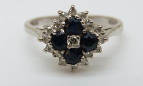 An 18ct white gold ring set with sapphires and diamonds in a cluster (size K)