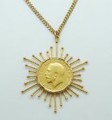 A 1917 gold full sovereign set in pendant mount on a yellow metal chain, 23.