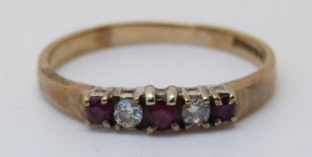 A 9ct gold ring set with rubies and diamonds (size T)