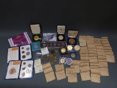 A box of miscellaneous cased coins and some in envelopes.